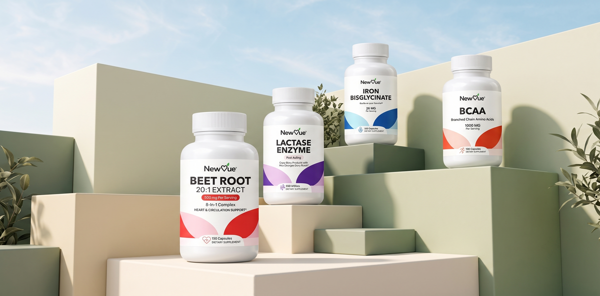 Magnesium Glycinate, Vitamin D3 + K2 and Omega-3 Fish Oil NewVue supplement bottles on a stone podium with green leaves