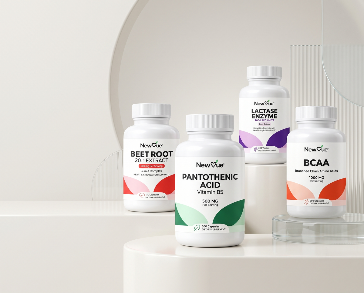 NewVue Magnesium Glycinate, Vitamin D3 + K2 and Omega-3 Fish Oil supplement bottles on a stone podium with green leaves
